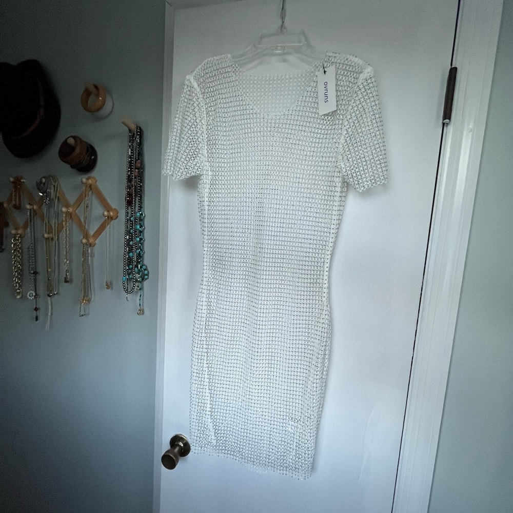 Ovruns Beaded swim or dress cover up. Tag says XL but more like OS